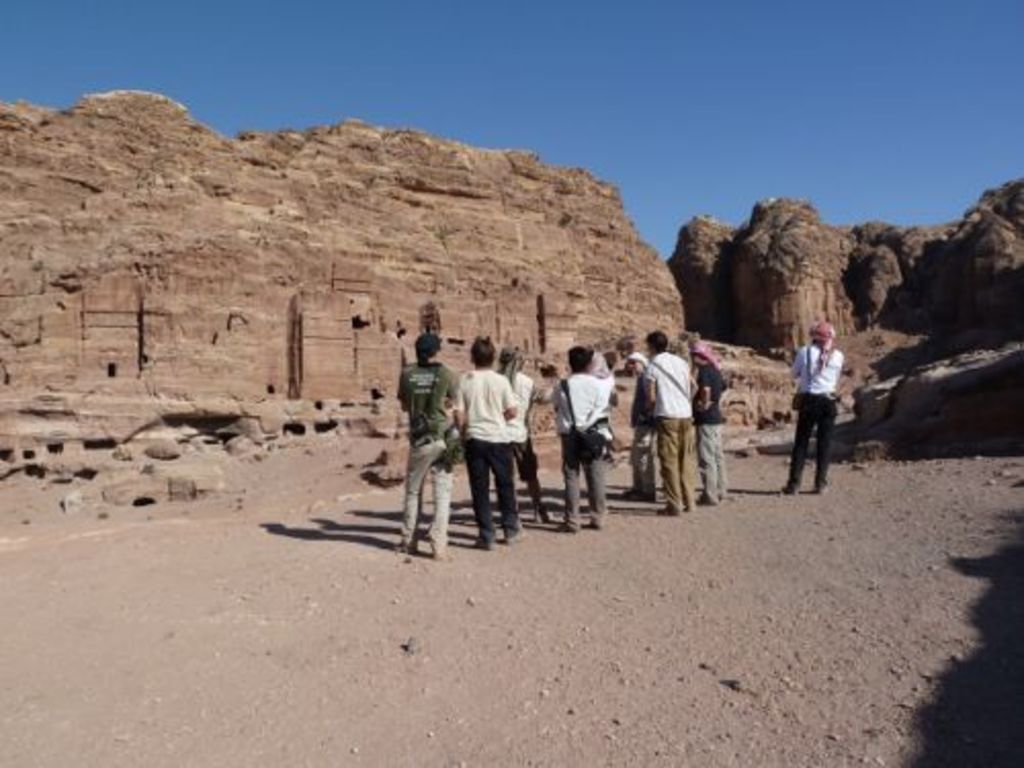 Fig. 12: Lucy Wadeson pointing out tombs BD 779 and 781 where her project is going to take place (photo: S. G. Schmid)