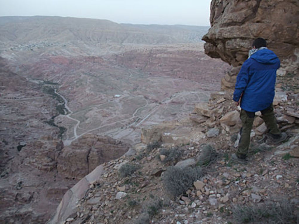 Stephan Schmid standing on the remains of a hypocaust system built on the edge of the rock (photo: A. Barmasse)