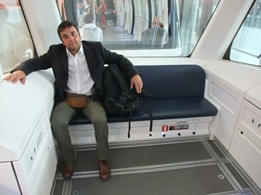 Laurent Gorgerat sitting in the Zurich airport shuttle listening delightedly to the authentic Swiss ambiance sounds for tourist (photo: A. Barmasse)