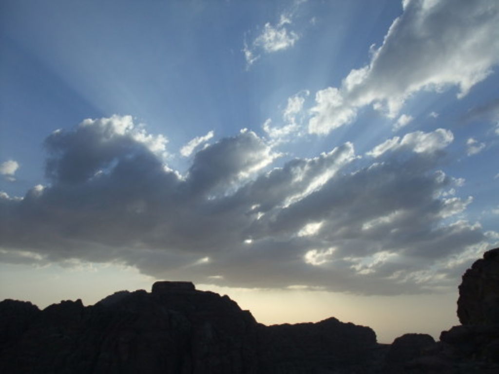 Fig. 32: Clouds open up as the sun sends its radiants towards the earth.