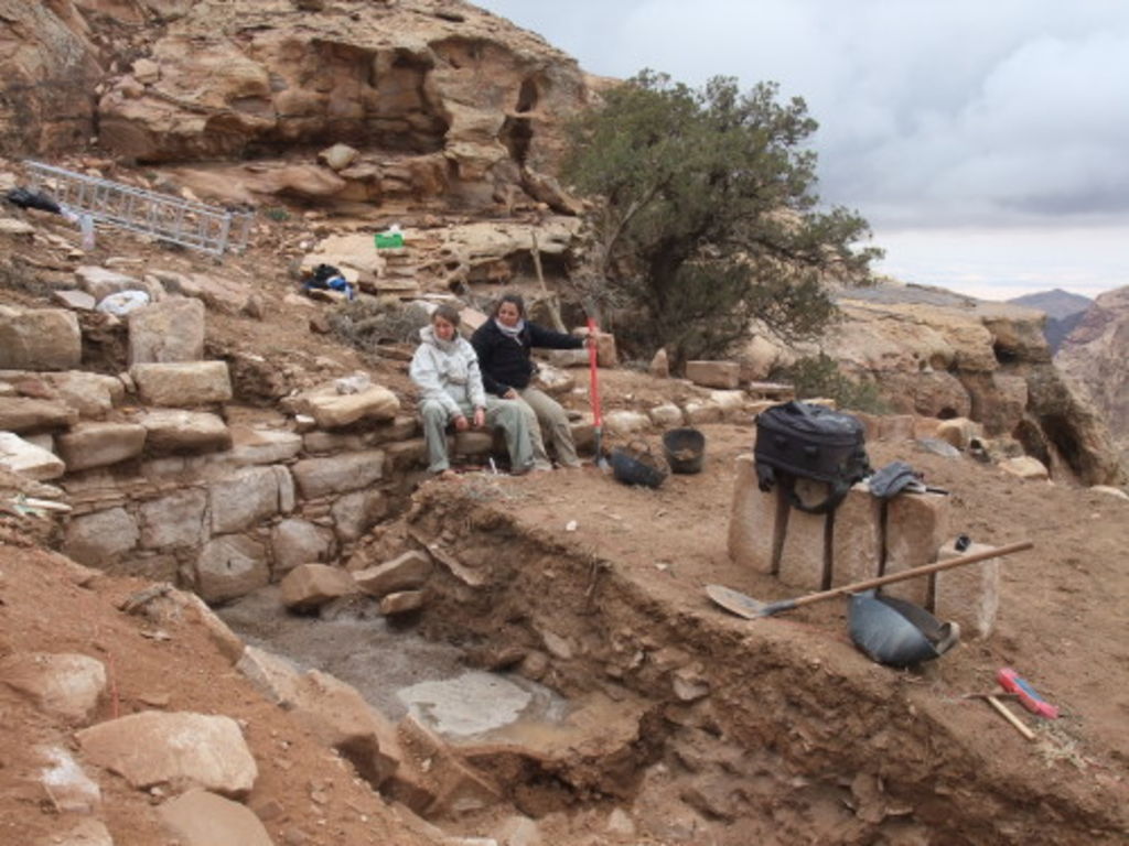 Fig. 37: Jana Falkenberg and Polly Agoridou staring into a trench filled up with rain water.