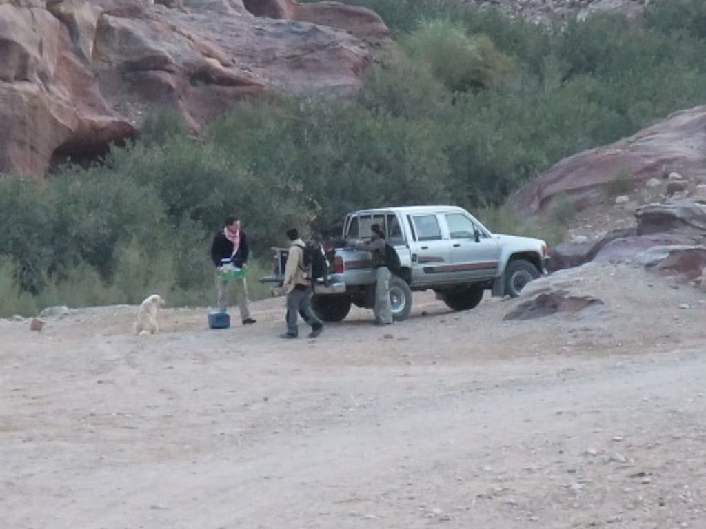 Fig. 46: Sebastian Hoffmann, Laurent Gorgerat and Aurelie Guet loading the truck with excavation stuff.