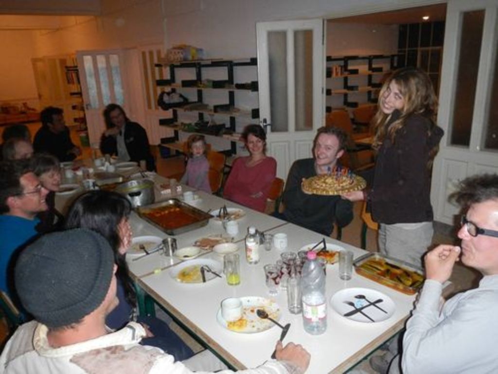 Fig. 57: Jan Reimann being offered baklavah birthday cake by Lydia Kappa.