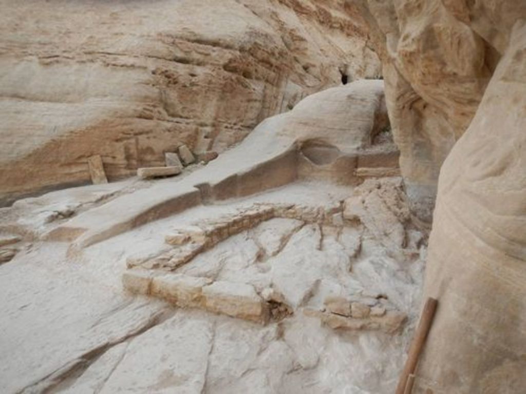 Fig. 64: Rock hewn and built structures near the Aslah triclinium.
