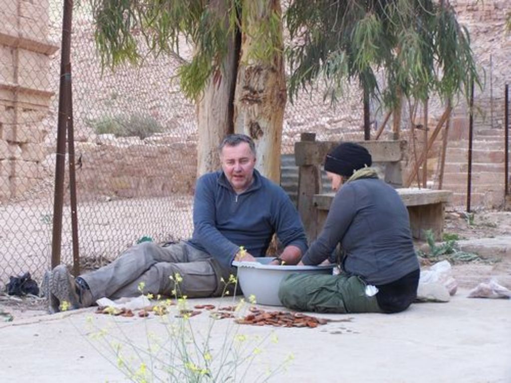 Fig. 74: Zbigniew Fiema and Maija Holappa washing pottery in the courtyard of Nazzal’s Camp.
