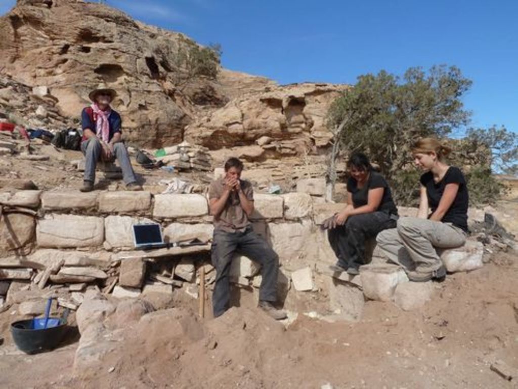 Fig. 76: Will Kennedy (centre) playing the harmonica, Piotr Bienkowski, Polly Agoridou and Lydia Kappa admiring.