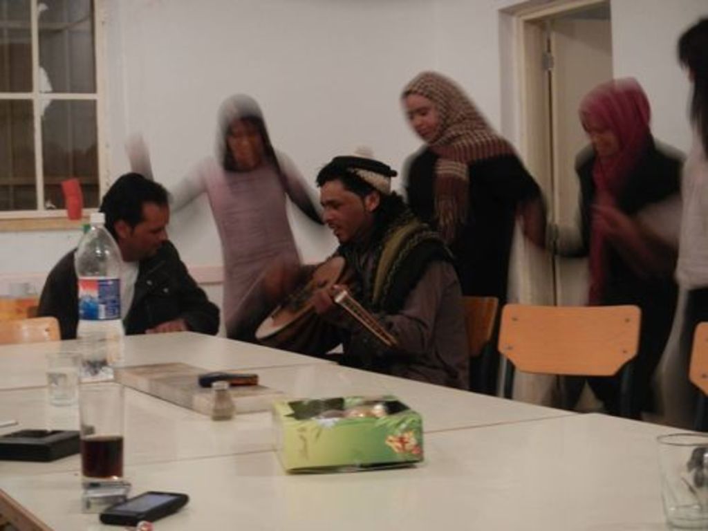 Fig. 82: Sheikh Eisa playing the Oud with ecstatic dancers in the background.