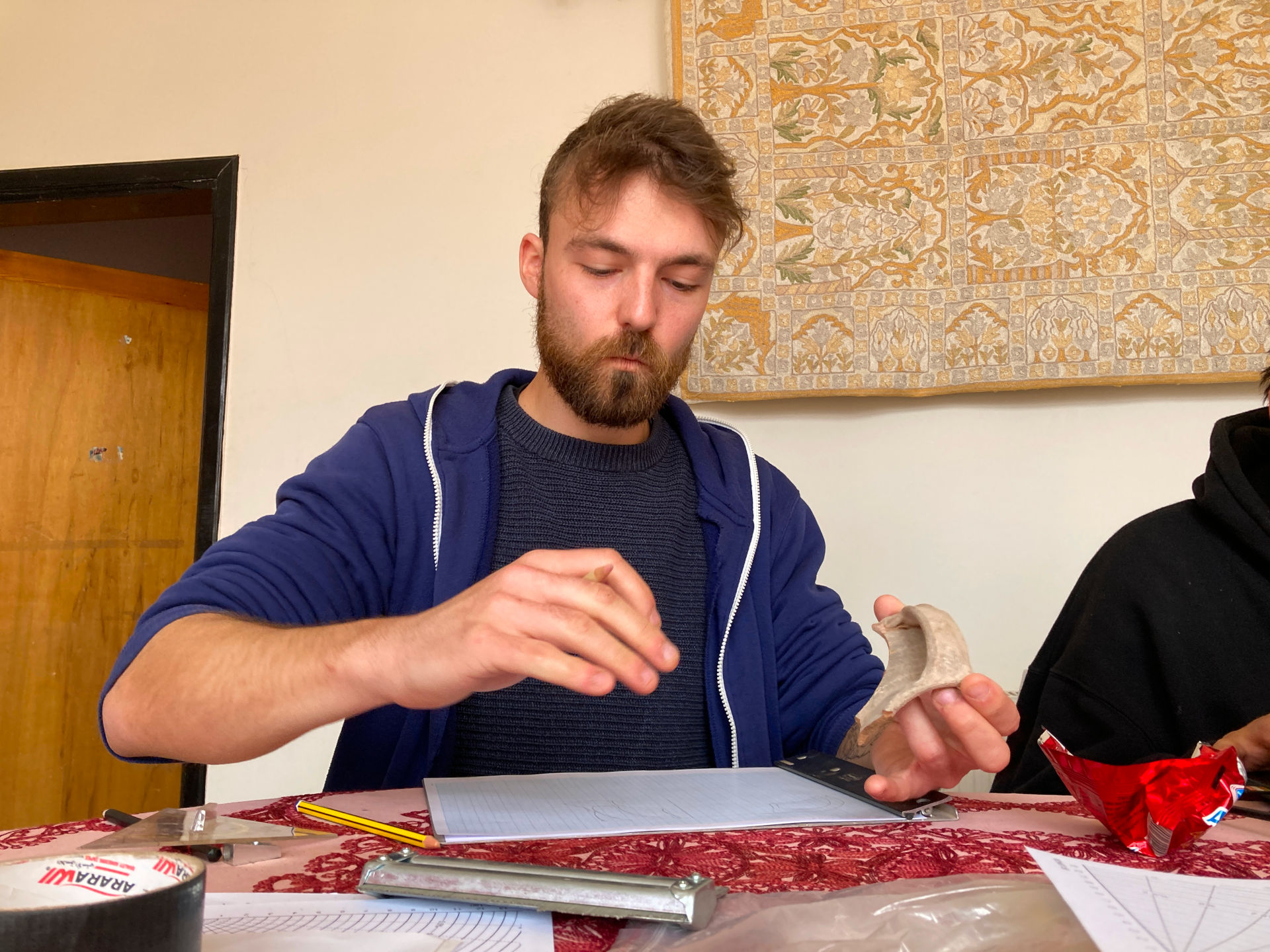Fig. 47: Niklas Jungmann struggeling with the drawing of some very special ceramic forms (photo: André Barmasse).
